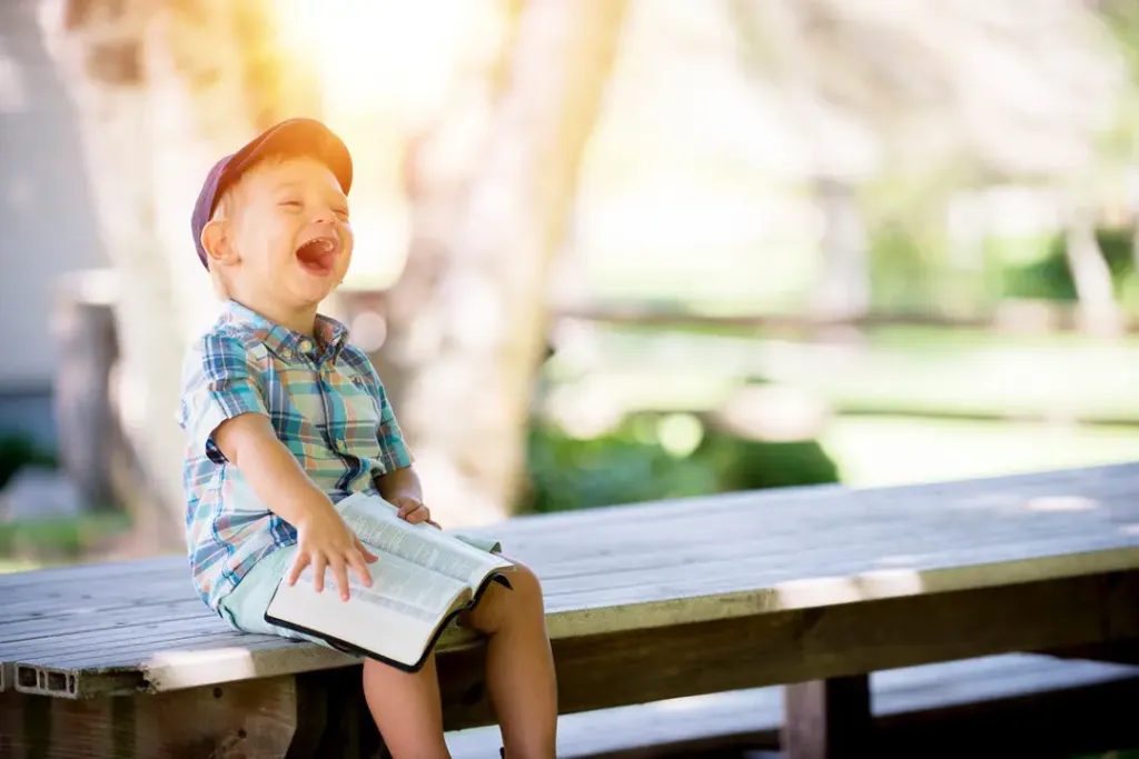 Kid reading and laughing — You should read more books that you like.