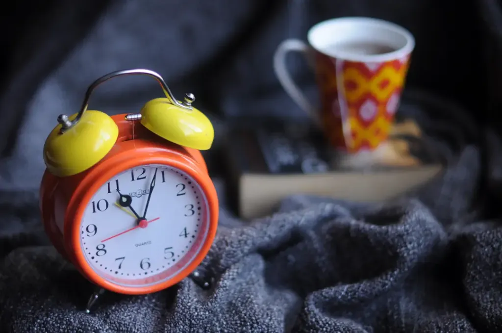 Clock, coffee, and book — Set regular hours to read and actually enjoy reading.